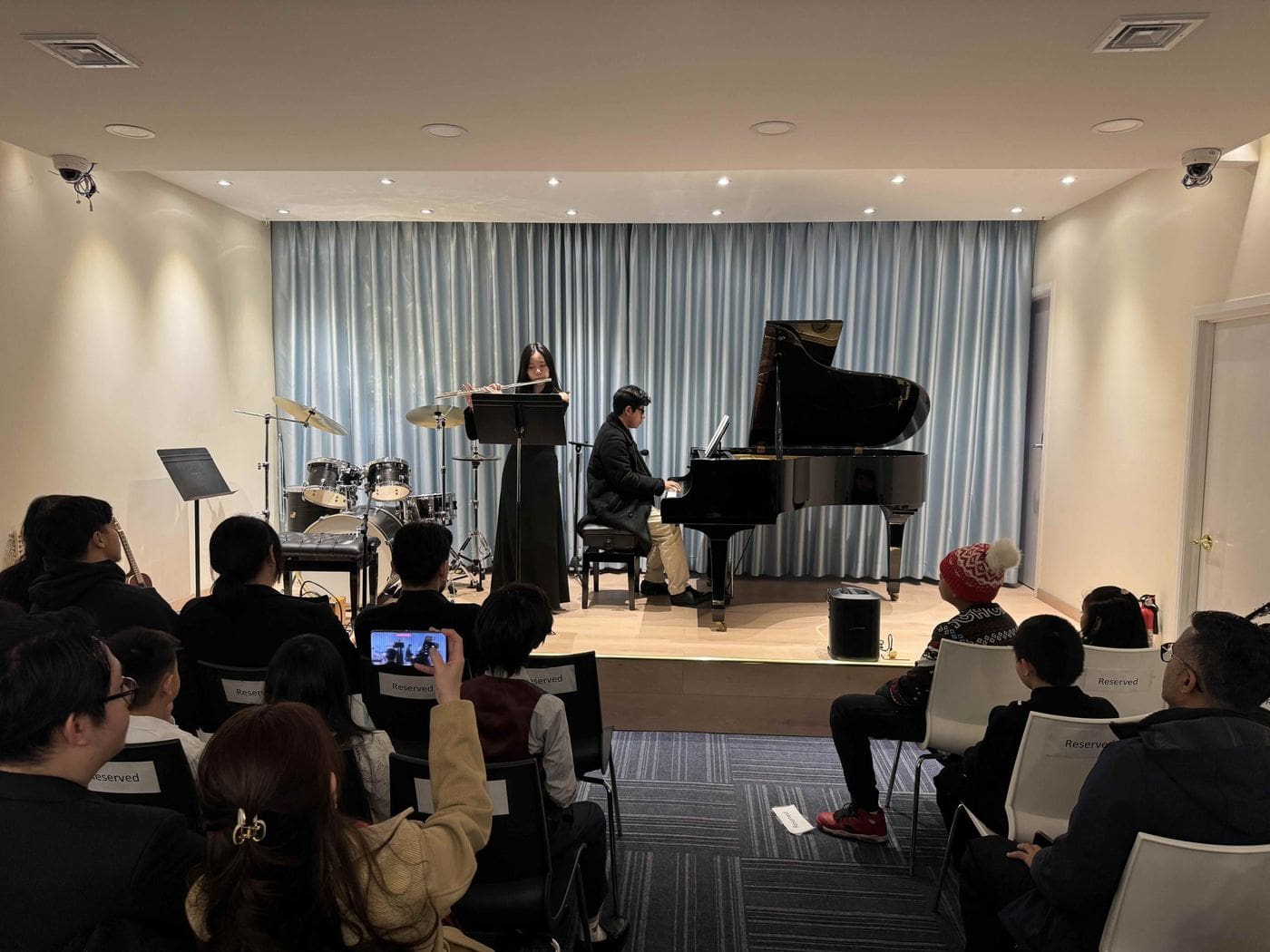 Flute and piano performance in the recital hall