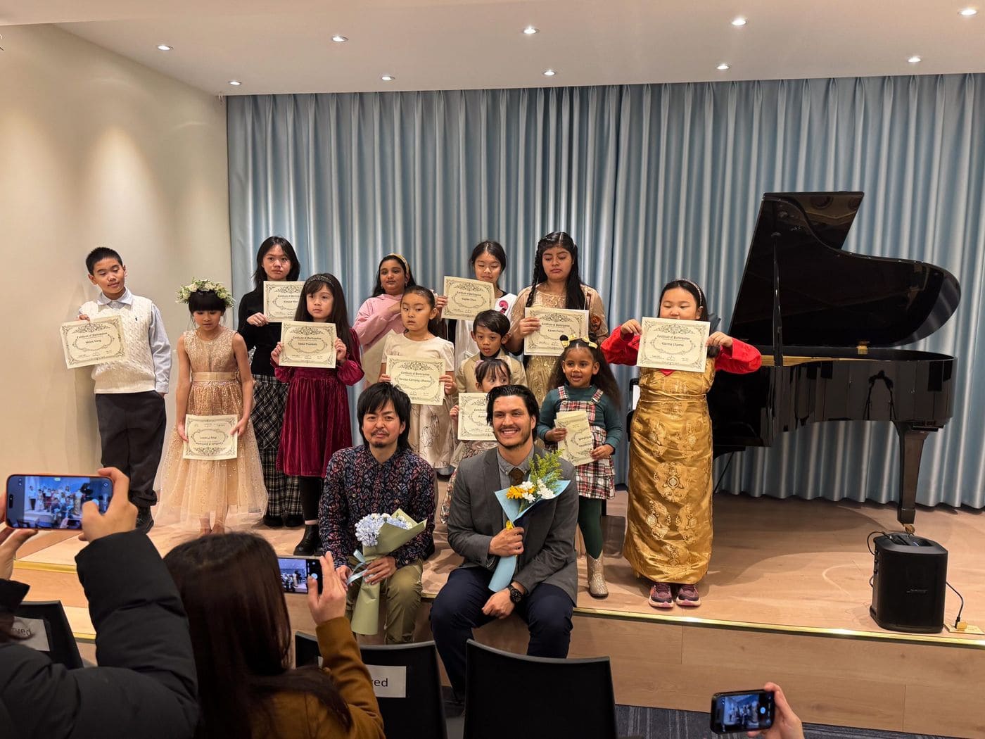 Musipire students take a bow at a student concert in Queens, NY